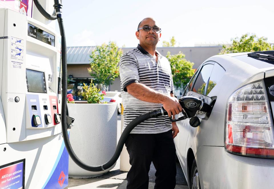 A man pumps gasoline into his car at a gas station in Millbrae, California, May 10, 2022 amid record gas prices. (Photo by Li Jianguo/Xinhua via Getty Images)