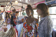 Models wear creations onboard a tram as part of the Missoni Spring-Summer 2020 collection, unveiled during the fashion week, in Milan, Italy, Thursday, Sept. 19, 2019. (AP Photo/Luca Bruno)