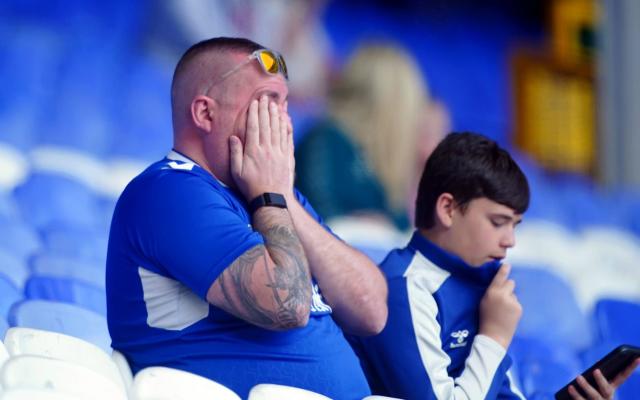 fan at Goodison - PA