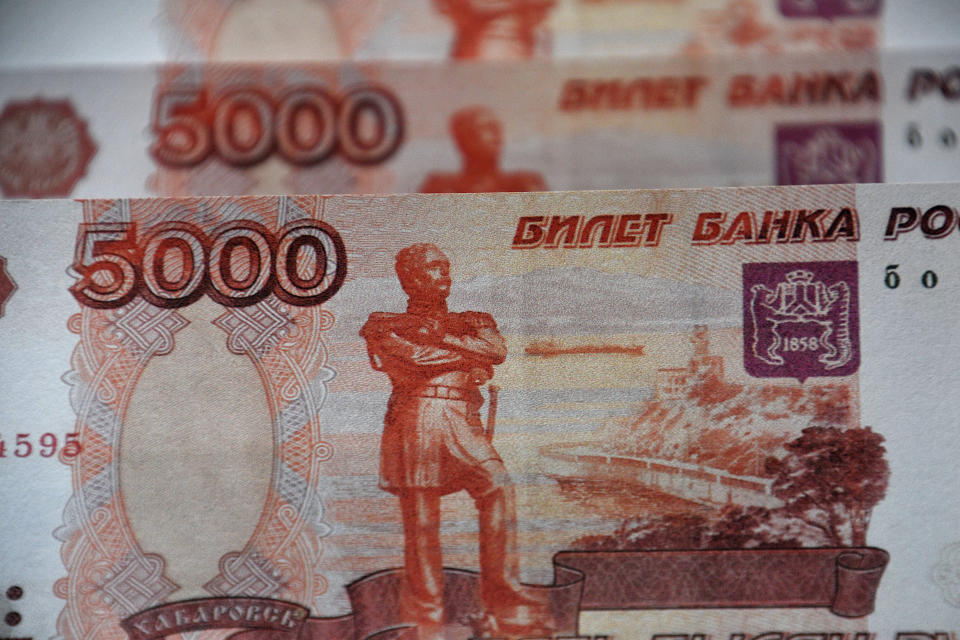 Russian banknotes of 5000 rubles seen displayed.The Russian ruble plunged almost 30% against the dollar after the invasion of Ukraine. The United States and the European Union had declared that they would exclude certain Russian banks from the international system of Swift banking payments. (Photo Illustration by Gerard Bottino/SOPA Images/LightRocket via Getty Images)