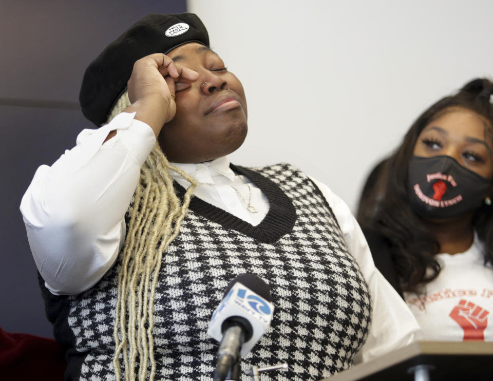 Donovon Lynch's sister Lauryn struggles not to cry Wednesday, Dec. 1, 2021, in Virginia Beach, Va., during a news conference about the prior day's report presented to the media by the Virginia Beach Commonwealth Attorney's office on Donovon's death. Leaders in the Black community of Virginia Beach called on Wednesday for a federal investigation into the police shooting of Donovon, a Black man, saying that his right to legally carry a gun and protect himself was ignored during a night of violence on the city's oceanfront. (Stephen M. Katz/The Virginian-Pilot via AP)