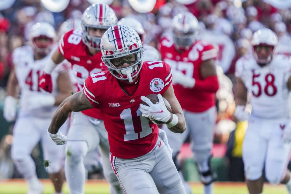 Sat., Jan. 1, 2022; Pasadena, California, USA; Ohio State Buckeyes wide receiver Jaxon Smith-Njigba (11) races to the end zone for a touchdown during the second quarter of the 108th Rose Bowl Game between the Ohio State Buckeyes and the Utah Utes at the Rose Bowl.