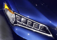 This photo shows the headlight array that features five bulbs on the 2015 Acura TLX, at the 2014 New York International Auto Show, at the Javits Convention Center, in New York, Wednesday, April 16, 2014. (AP Photo/Richard Drew)