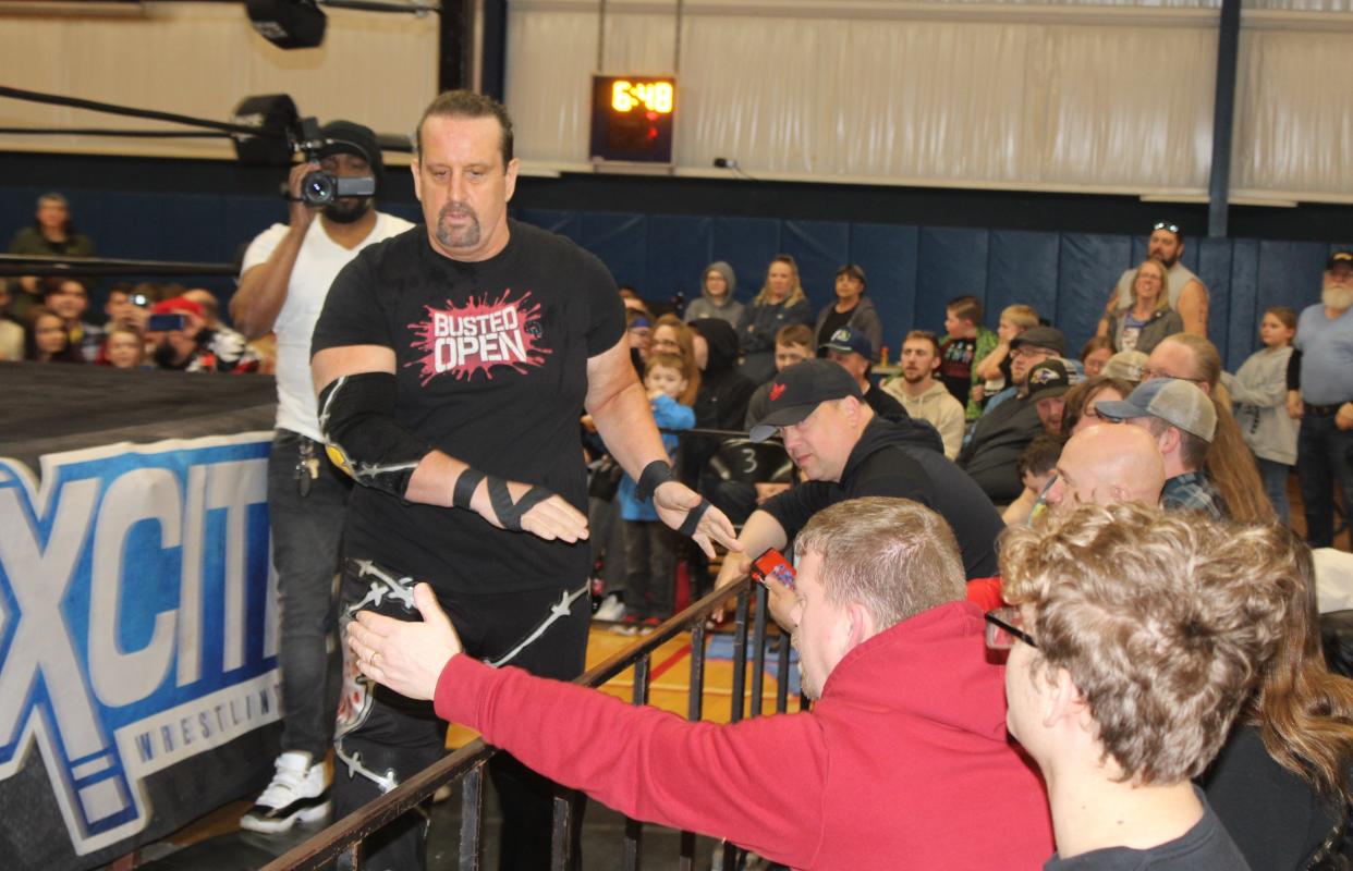 Tommy Dreamer, a former ECW and WWE regular, greets fans on his way to the ring during Xcite Wrestling's first-ever event in Hornell Saturday, March 30, 2024 at the YMCA.