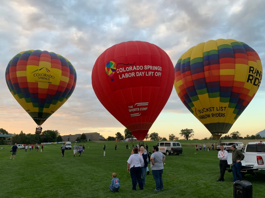 Balloons gather at Memorial Park Friday morning, ahead of this weekend's Labor Day Lift Off. / Krista Witiak - FOX21 News