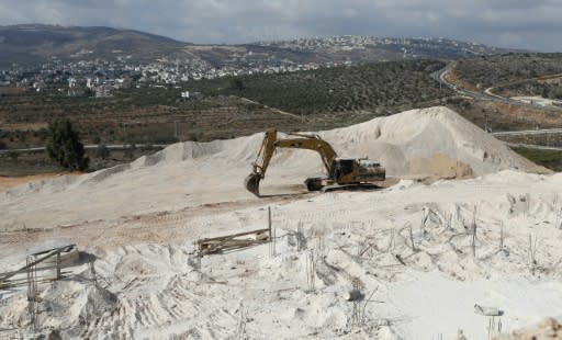 A digger is seen at a construction site in the settlement of Amichai in the occupied West Bank on September 7, 2018
