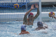 U.S. Olympic Water Polo Team attacker Max Irving (22) trains for the Paris Olympics, at Mt. San Antonio College in Walnut, Calif., on Wednesday, Jan. 17, 2024. Irving's father, Michael Irving, is a Pac-12 college basketball referee. Max Irving is also the only Black man on the U.S. Olympic Water Polo Team and a prominent advocate for diversity in the sport. (AP Photo/Damian Dovarganes)