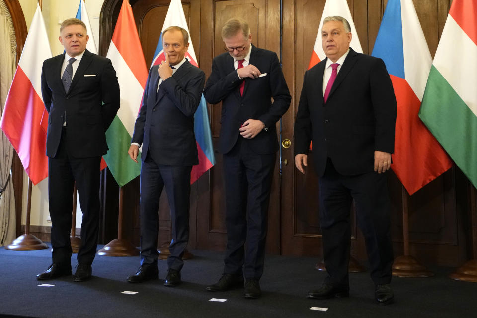 From left, Prime Minister of Slovakia Robert Fico, Prime Minsiter of Poland Donald Tusk, Prime Minister of Czech Republic Petr Fiala, and Prime Minister of Hungary Viktor Orban pose for a photo during their V4 meeting in Prague, Czech Republic, Tuesday, Feb. 27, 2024. (AP Photo/Petr David Josek)