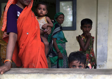 FILE PHOTO: A Hindu family is seen at a shelter near Maungdaw, Rakhine state, Myanmar September 12, 2017. REUTERS/Stringer/File Photo