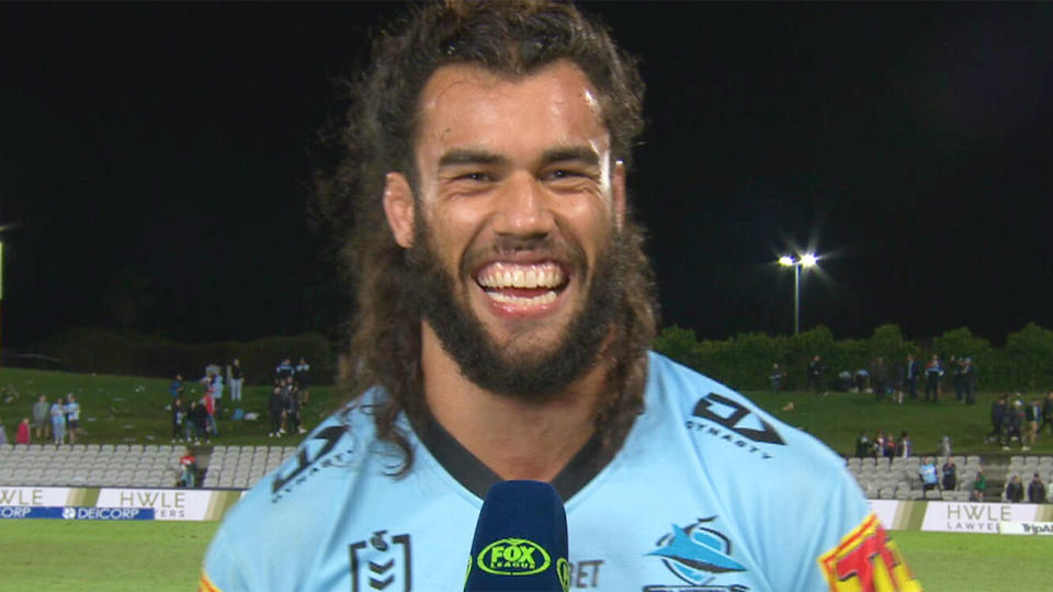 Pictured here, Cronulla star Toby Rudolf partakes in a post-match interview on Fox Sports.