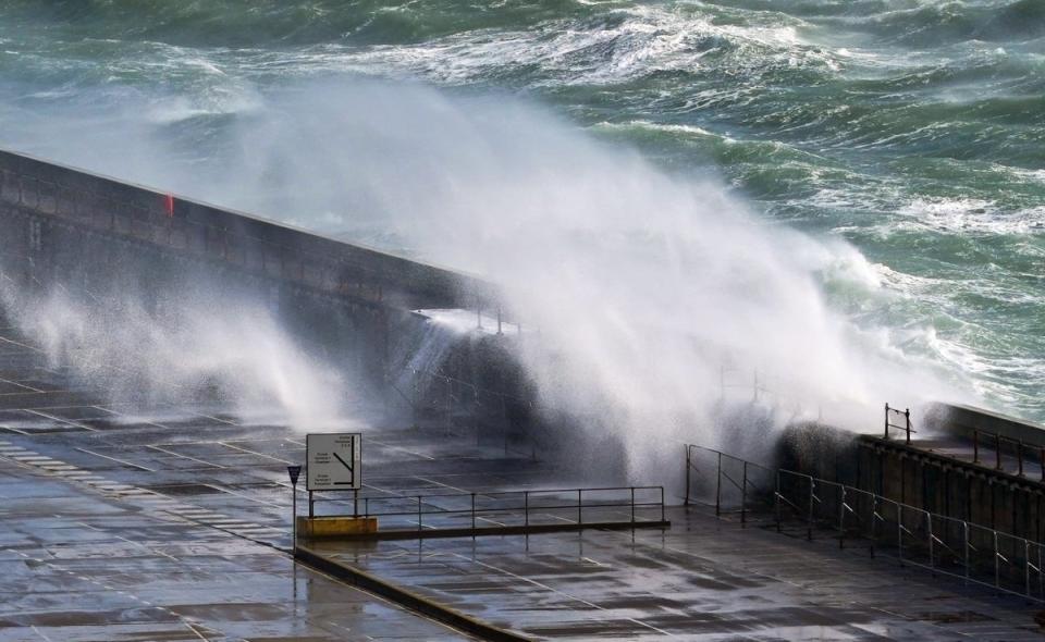 Waves crash over the harbour wall in Dover, Kent (Gareth Fuller/PA Wire)