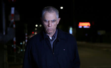 FILE PHOTO: Arnon Mozes, the owner and publisher of Yedioth Ahronoth, one of Israel's leading newspapers, leaves a police investigation unit in Lod, Israel, January 15, 2017. Picture taken January 15, 2017. REUTERS/Stringer/File Photo ISRAEL OUT.