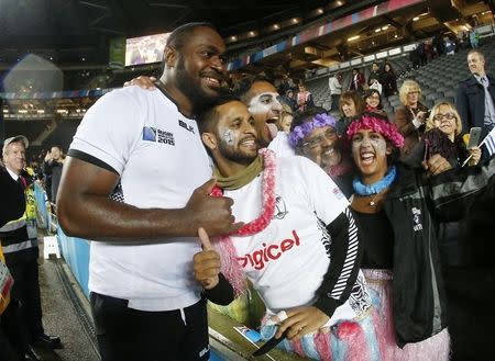 Rugby Union - Uruguay v Fiji - IRB Rugby World Cup 2015 Pool A - Stadium MK, Milton Keynes, England - 6/10/15 Fiji's Api Ratuniyarawa celebrates with fans at the end of the match Action Images via Reuters / Andrew Boyers Livepic