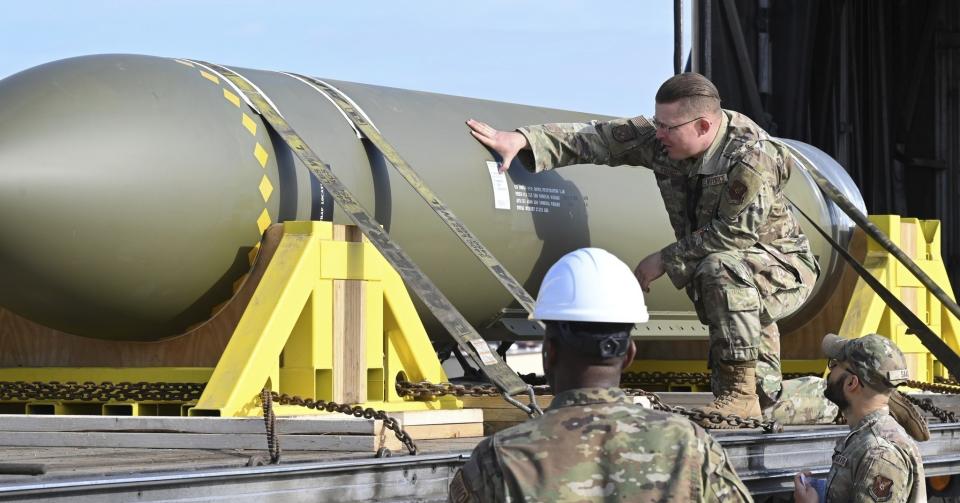 In this photo released by the U.S. Air Force on May 2, 2023, airmen look at a GBU-57, or the Massive Ordnance Penetrator bomb, at Whiteman Air Base in Missouri. That U.S. bomb, designed to destroy underground sites at the height of concerns a decade ago over Iran's nuclear program, has briefly reappeared amid new tensions with the Islamic Republic. (U.S. Air Force via AP)