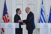 Greece's Foreign Minister Nikos Dendias, right, and US Secretary of State Antony Blinken, are seen during a press conference in Athens, Greece, on Tuesday, Feb. 21, 2023. Blinken is on a two-day trip in Athens, after his visit to Turkey, to meet with the country's leadership and launch the fourth round of the US-Greece Strategic Dialogue. (AP Photo/Michael Varaklas, Pool)