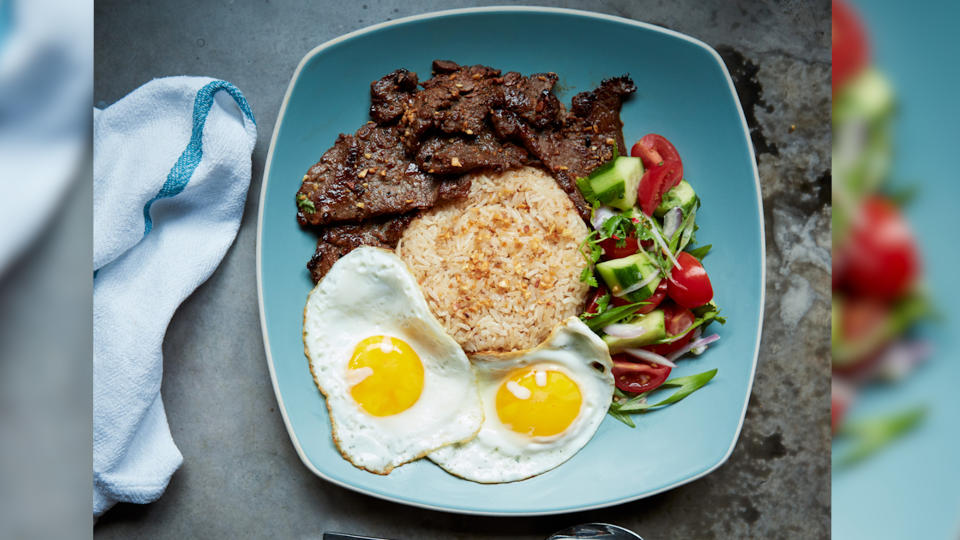 This Filipino-inspired breakfast includes steak, rice, eggs and cucumber salad.