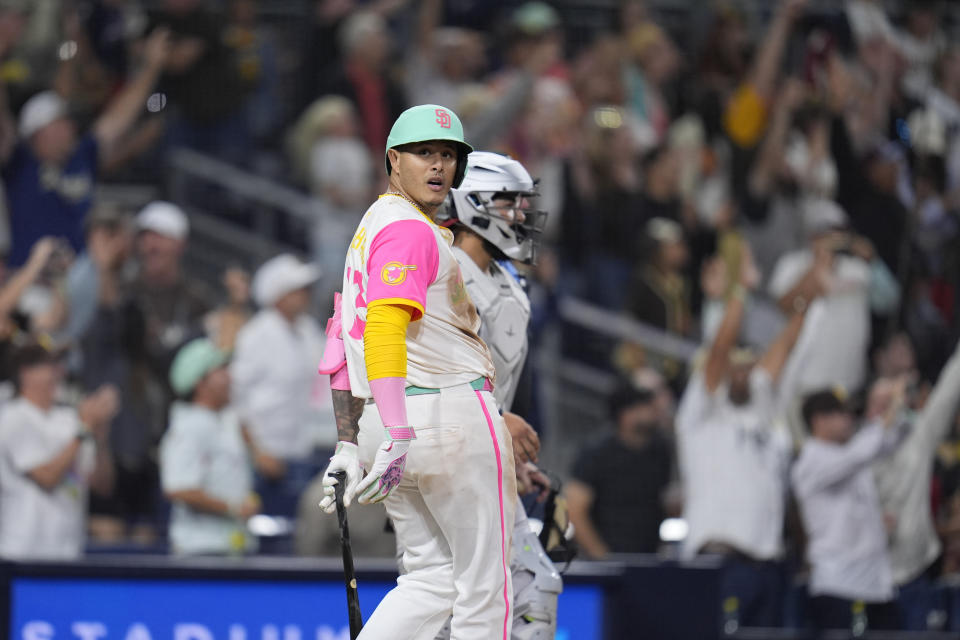 San Diego Padres' Manny Machado celebrates after hitting a game-winning two-run home run during the ninth inning of a baseball game against the Arizona Diamondbacks, Friday, July 5, 2024, in San Diego. The Padres won, 10-8. (AP Photo/Gregory Bull)