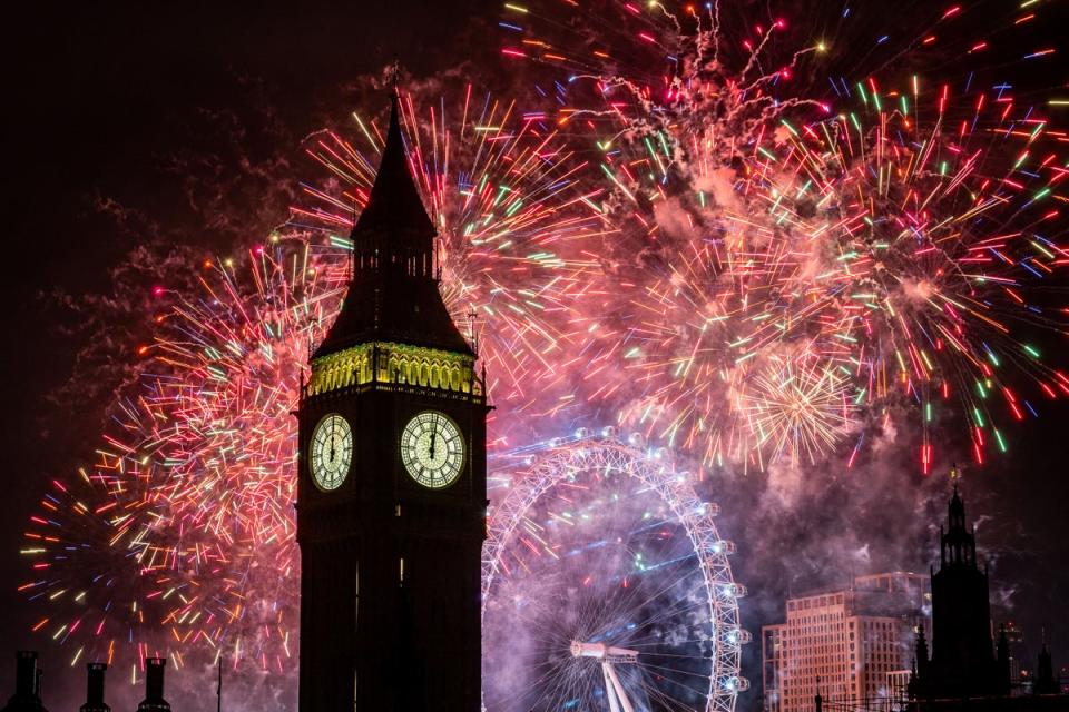 Fireworks light up the sky over the London Eye and the Elizabeth Tower (Big Ben) in central London during the New Year celebrations (Aaron Chown/PA) (PA Wire)