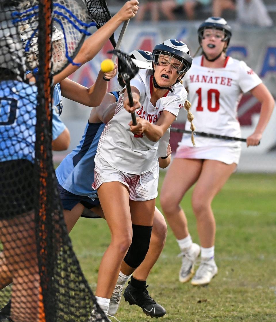 Manatee's Grace Knowles attempts unsuccessful score against Newsome during the region quarterfinal game at Manatee's Joe Kinnan Field at Hawkins Stadium in Bradenton. Knowles scored the winning point in overtime to advance Manatee to the region semifinal.