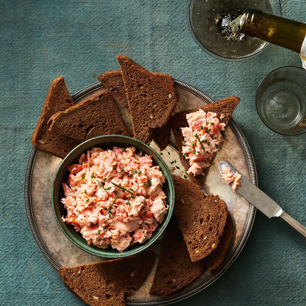 salmon rillette in a bowl with toasted rye bread