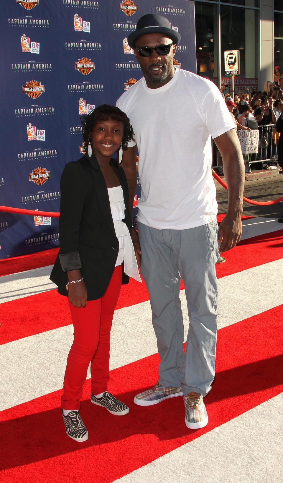 HOLLYWOOD, CA - JULY 19: Actor Idris Elba (R) and his daughter attend the 'Captain America: The First Avenger' Los Angeles Premiere at the El Capitan Theater on July 19, 2011 in Hollywood, California.  (Photo by Frederick M. Brown/Getty Images)