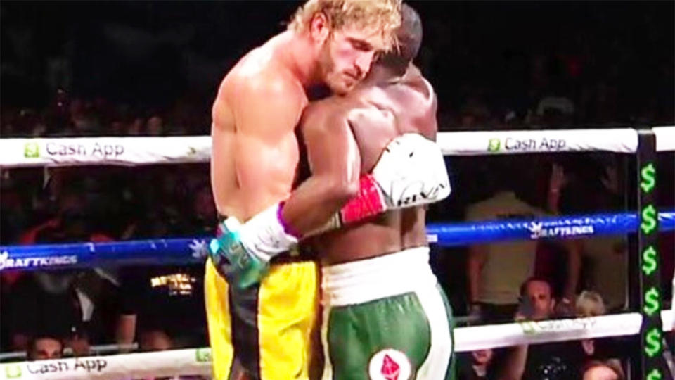 Logan Paul (pictured left) wrapping-up Floyd Mayweather (pictured right) during their bout fight.