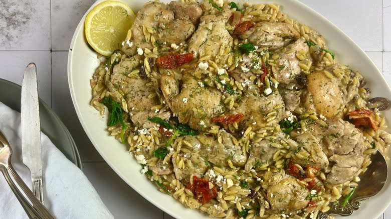 chicken orzo on platter with lemon slice