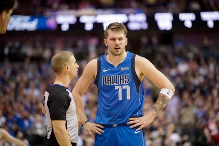 Apr 9, 2019; Dallas, TX, USA; Dallas Mavericks forward Luka Doncic (77) argues a call with referee Tyler Ford (39) during the game against the Phoenix Suns at the American Airlines Center. Mandatory Credit: Jerome Miron-USA TODAY Sports