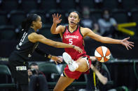 Las Vegas Aces' Dearica Hamby (5) defends against Seattle Storm's Jordin Canada in the first half of a WNBA basketball game Saturday, May 15, 2021, in Everett, Wash. (AP Photo/Elaine Thompson)