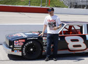 Dale Earnhardt Jr. stands by the car he will drive in pre-race activities before the NASCAR Xfinity Series auto race at Darlington Raceway, Saturday, May 8, 2021, in Darlington, S.C. The car is a Chevy Nova that his father drove in what is now the Xfinity Series. (AP Photo/Terry Renna)