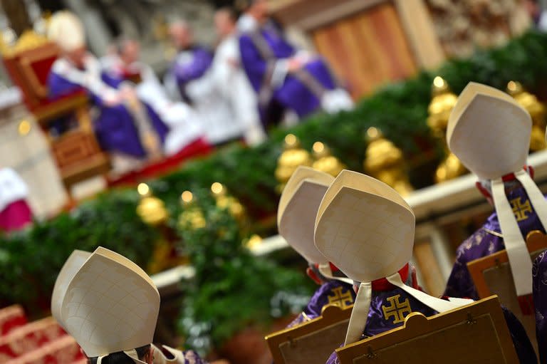 Cardinals look at Pope Benedict XVI leading the mass for Ash Wednesdayon February 13, 2013 at St Peter's Basilica at the Vatican. The Vatican said it could speed up the election of a new pope as lobbying for Benedict XVI's job intensified amid speculation over who had the best chance to succeed him