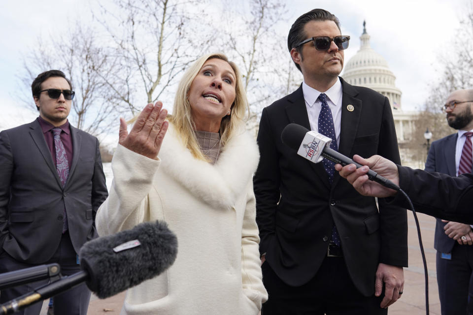 Rep. Matt Gaetz, R-Fla., right, and Rep. Marjorie Taylor Greene, R-Ga., left speak on the west side of the U.S. Capitol in Washington, Thursday, Jan. 6, 2022, on the one year anniversary of the attack on the U.S. Capitol. (AP Photo/Carolyn Kaster)