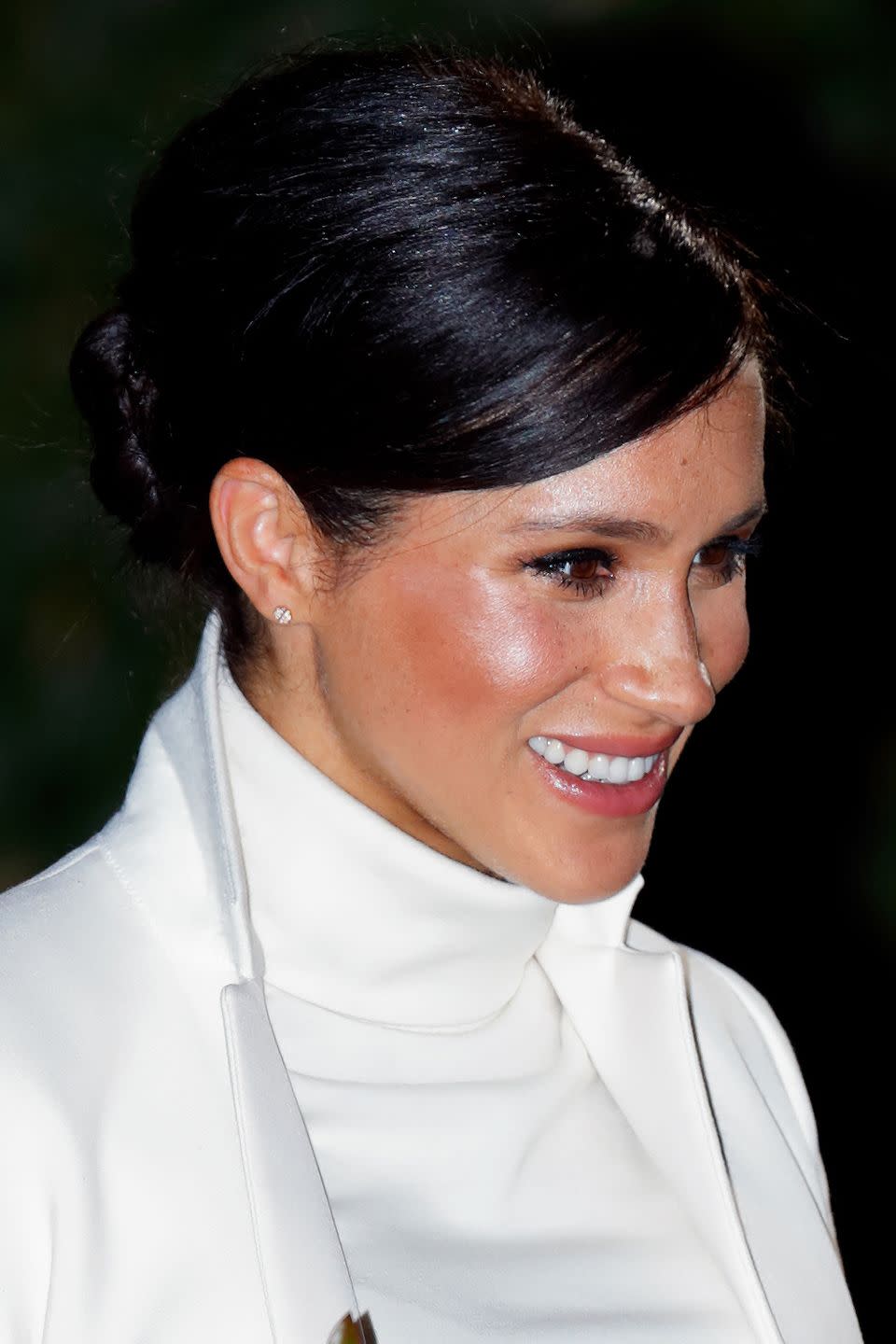 Meghan with a 60s style beehive and glowing, bronzed make-up at the gala performance of 'The Wider Earth', 2019