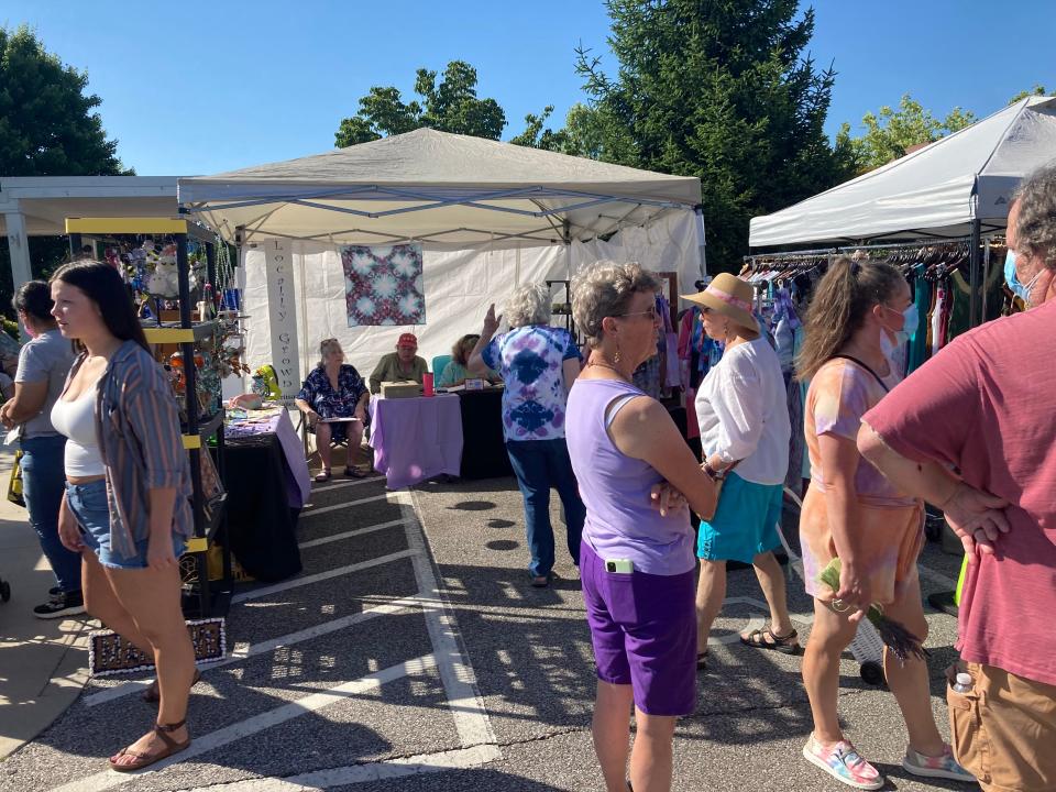 A crowd gathers near the booths at the Lavender Festival Saturday, June 18, 2022.