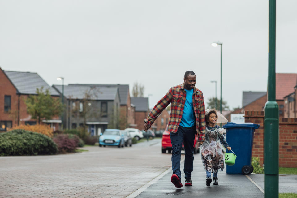 Stock picture of dad and daughter going trick or treating at Halloween. (Getty Images)