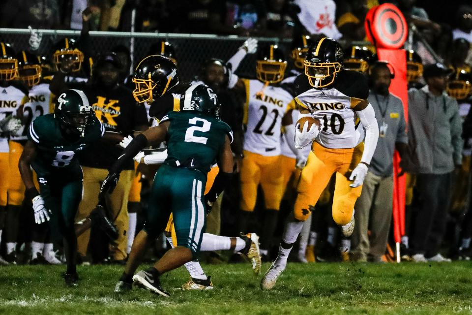 Detroit King wide receiver Samuel Washington (10) runs against Detroit Cass Tech defensive back Sean Hodges (2) during the first half at Cass Technical High School in Detroit on Friday, Sept. 16, 2022.