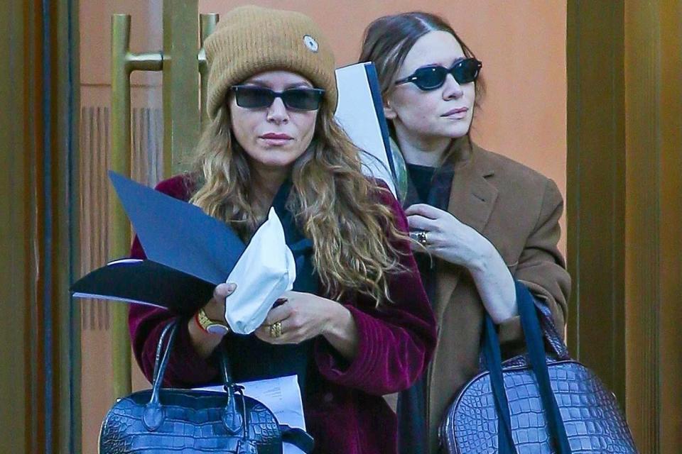 <p>BACKGRID</p> Ashley Olsen and Mary-Kate Olsen pictured leaving a building in New York City on Thursday