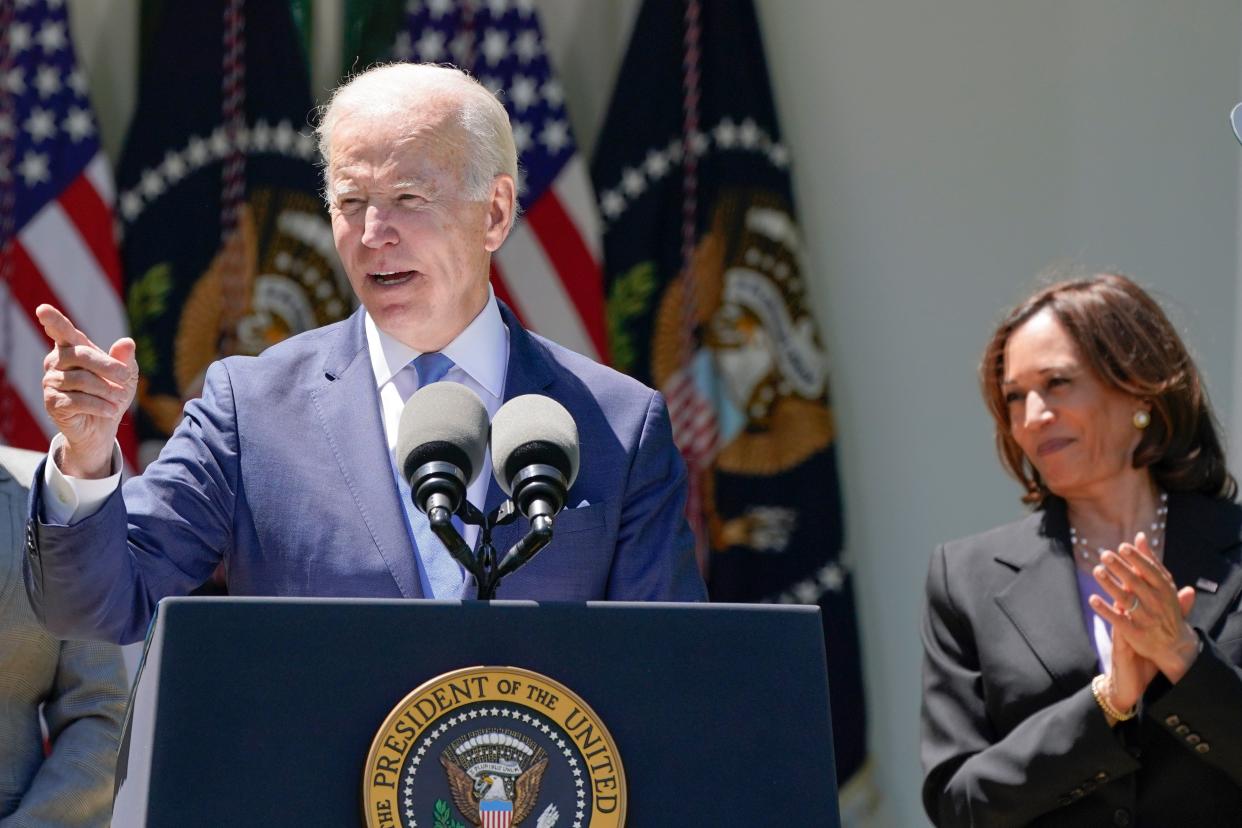 President Joe Biden speaks May 9 at an event on lowering the cost of high-speed internet. Vice President Kamala Harris applauds at right.