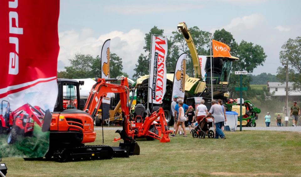 Visitors walk among the equipment displays at Penn State’s Ag Progress Days on Tuesday, Aug. 9, 2022.