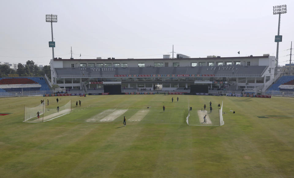 The Zimbabwe cricket team, left, and the Pakistan's cricket team, right, attend a practice session at the Pindi Cricket Stadium, in Rawalpindi, Pakistan, Thursday, Oct. 29, 2020. The Zimbabwe cricket team is in Pakistan to play three ODIs and three Twenty20 International match series, beginning with the first ODI on Friday. (AP Photo/Anjum Naveed)