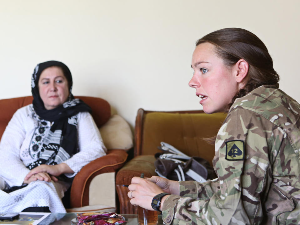 Hearts and minds: Lieutenant Jessic French, a female engagement officer, talks to an Afghan woman in an effort to gain her trust (Alison Baskerville)
