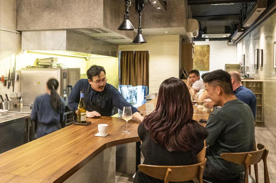 Woo Wai Leong serves guests at Restaurant Ibid.