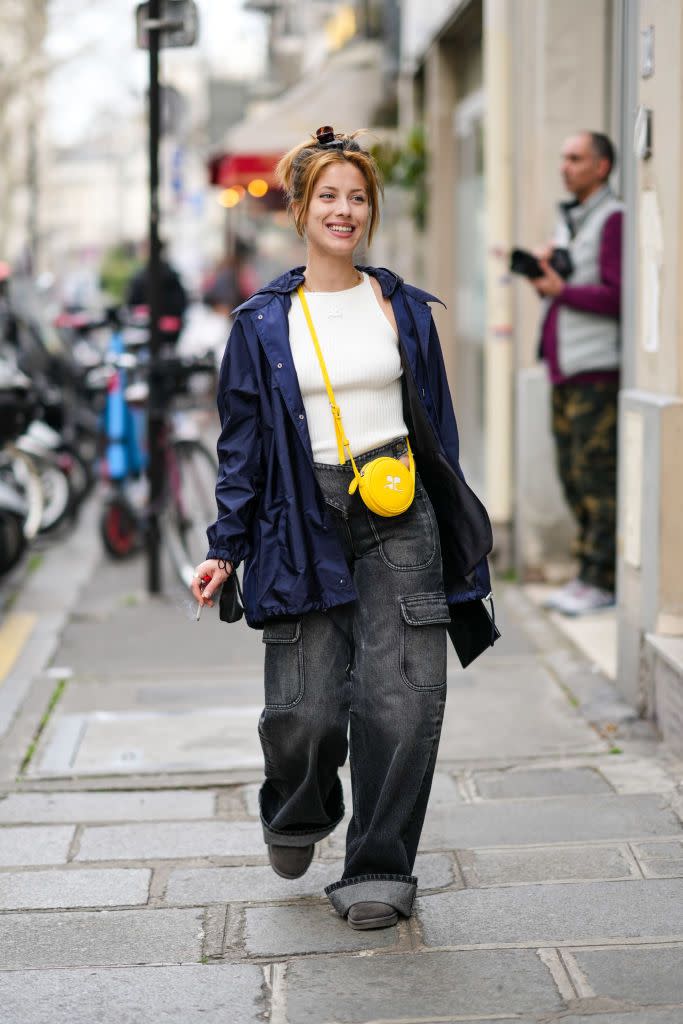 paris, france march 02 a guest wears a brown and black print pattern hair clip