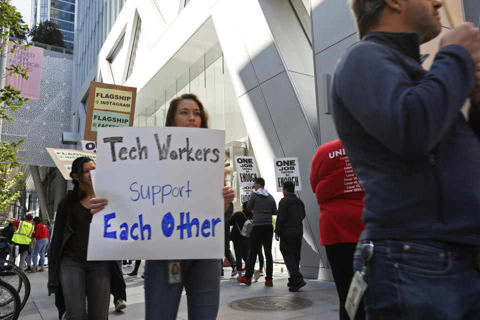 In this photo taken July 16, 2019, tech workers march to support Facebook's cafeteria workers, who were rallying for a new contract with their company Flaghship in San Francisco. Tech workers are speaking out on issues of immigration, the environment, sexual misconduct and military warfare like never before. Google, Amazon and Microsoft employees protest against how their work is used by the government. Through petitions and collective actions, others push for better internal policies, greener practices and better work conditions for contractors. (AP Photo/Samantha Maldonado)