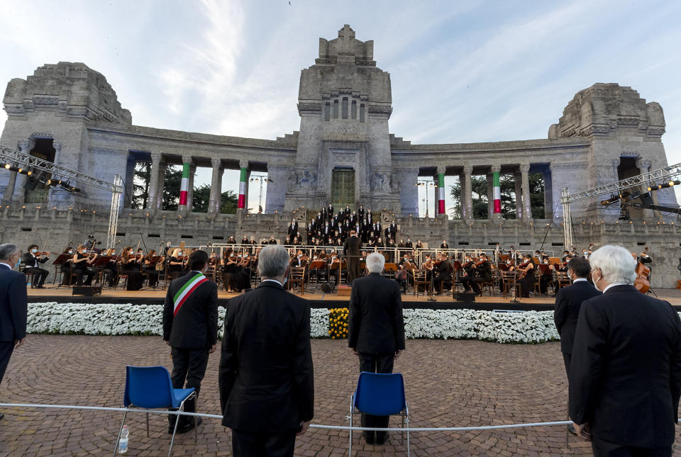 Italian President Sergio Mattarella, center, speaks in front of Bergamo's cemetery, Sunday, June 28, 2020. Italy bid farewell to its coronavirus dead on Sunday with a haunting Requiem concert performed at the entrance to the cemetery of Bergamo, the hardest-hit province in the onetime epicenter of the outbreak in Europe. President Sergio Mattarella was the guest of honor, and said his presence made clear that all of Italy was bowing down to honor Bergamo’s dead, “the thousands of men and women killed by a sickness that is still greatly unknown and continues to threaten the world.” (Italian Presidency via AP)