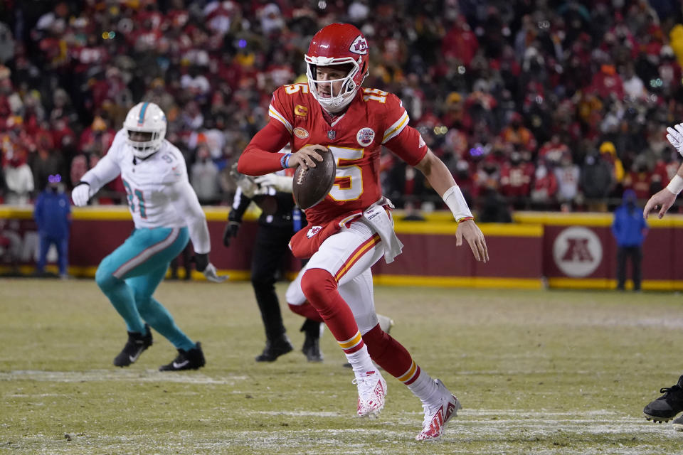 Kansas City Chiefs quarterback Patrick Mahomes (15) runs against the Miami Dolphins during the second half of an NFL wild-card playoff football game Saturday, Jan. 13, 2024, in Kansas City, Mo. (AP Photo/Ed Zurga)