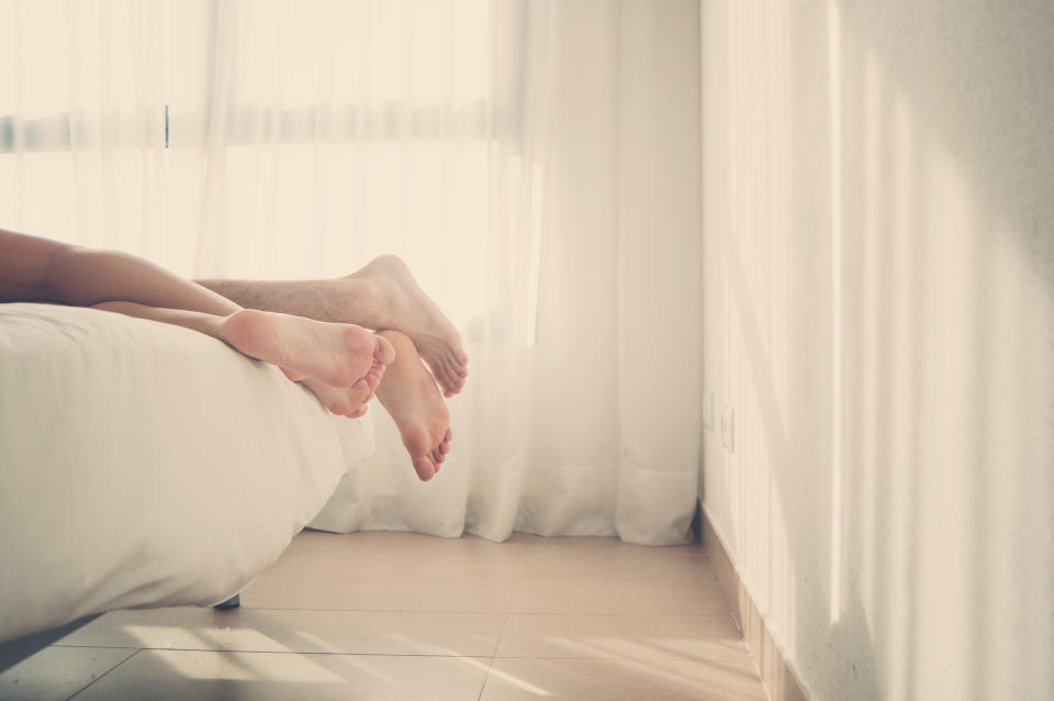 feet at the end of the bed