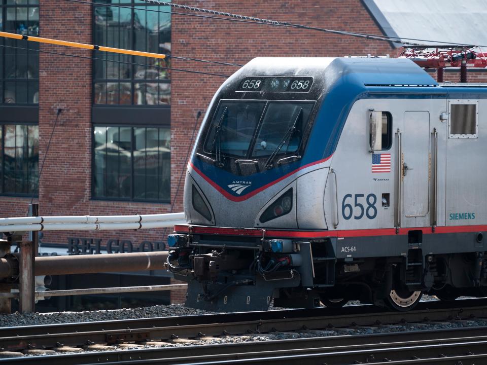 An Amtrak train pulls out of Union Station on Wednesday, April 7, 2021.