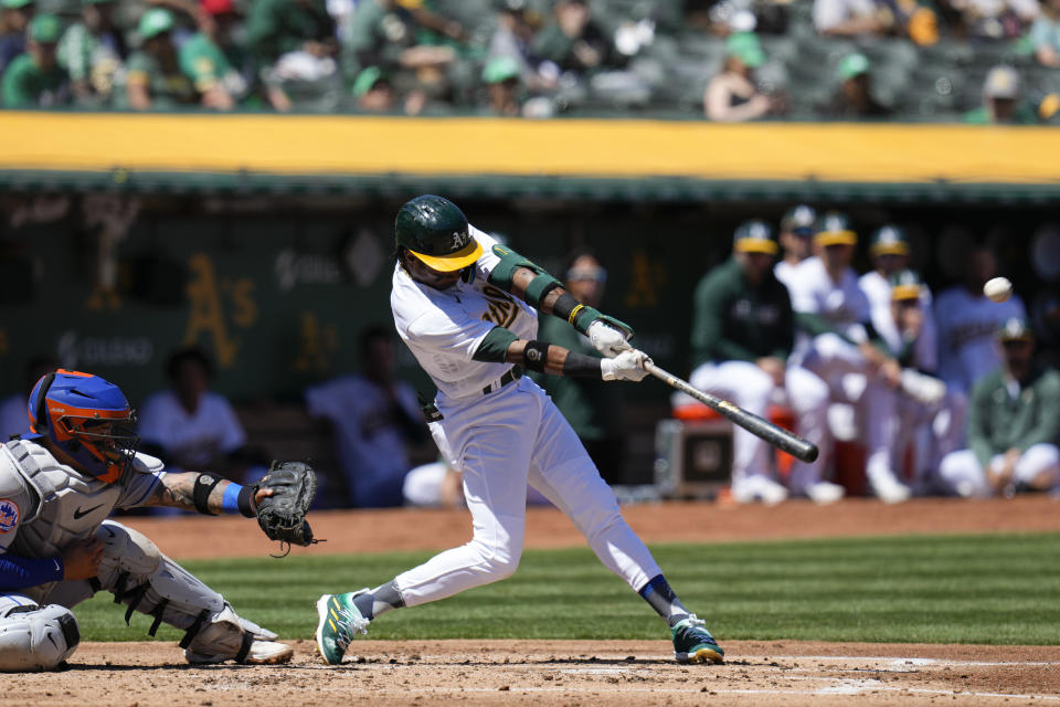 Oakland Athletics' Esteury Ruiz, right, hits an RBI-single against the New York Mets during the second inning of a baseball game in Oakland, Calif., Saturday, April 15, 2023. (AP Photo/Godofredo A. Vásquez)