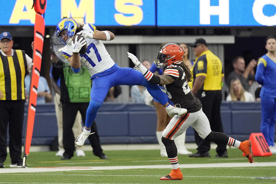 Los Angeles Rams wide receiver Puka Nacua, left, catches a pass in front of Cleveland Browns cornerback Mike Ford Jr. of an NFL football game Sunday, Dec. 3, 2023, in Inglewood, Calif. (AP Photo/Mark J. Terrill)